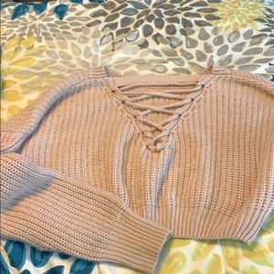 Cropped blush sweater with cross tie open back